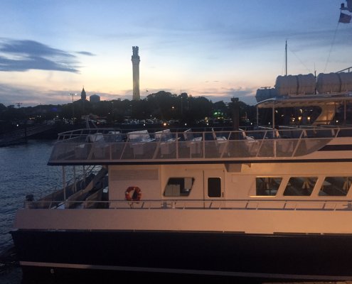 Whale watch boat returning to Provincetown harbor at sunset